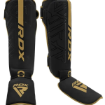 ESPINILLERA AURA NEGRO CON DORADO RDX XL